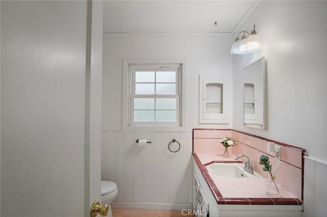 bathroom featuring toilet and vanity