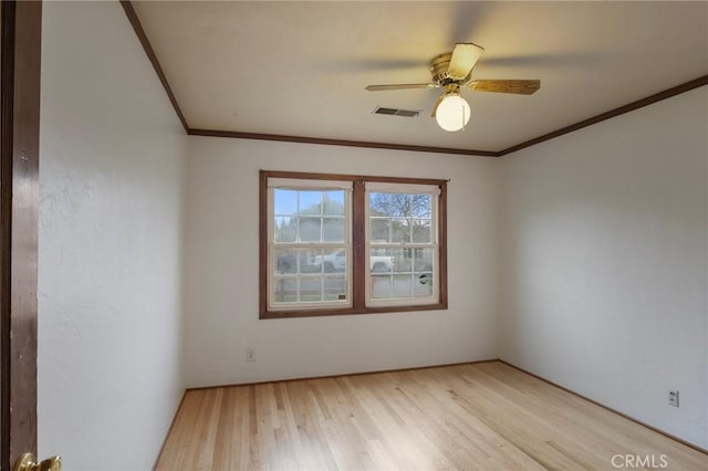 spare room with light hardwood / wood-style floors and ceiling fan