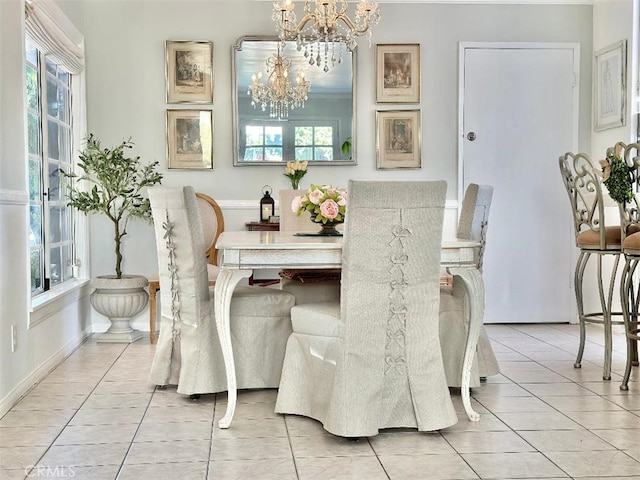 tiled dining area with an inviting chandelier