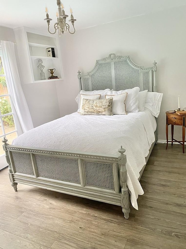 bedroom with a notable chandelier