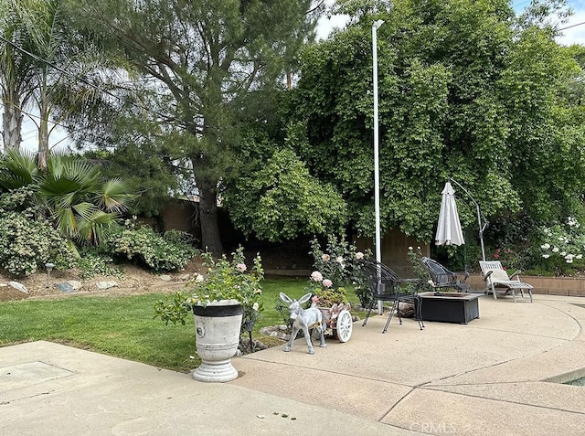 view of patio / terrace with a fire pit