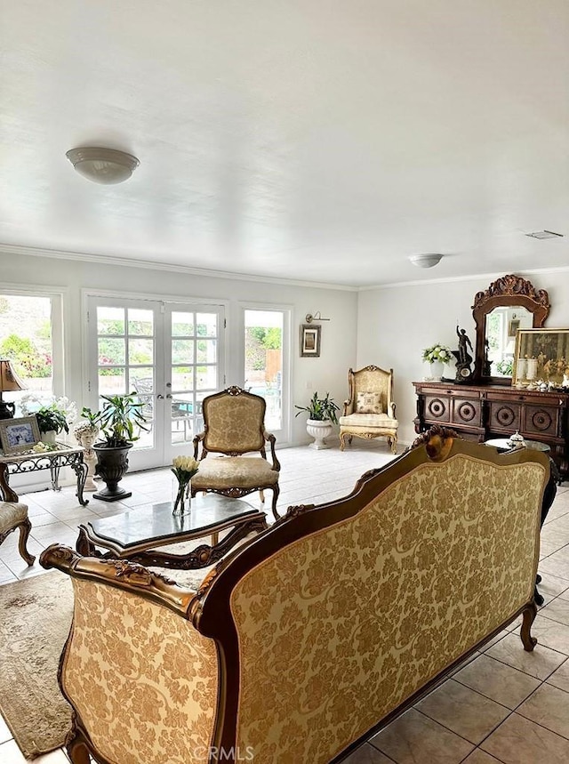 living room featuring ornamental molding, light tile patterned flooring, and french doors