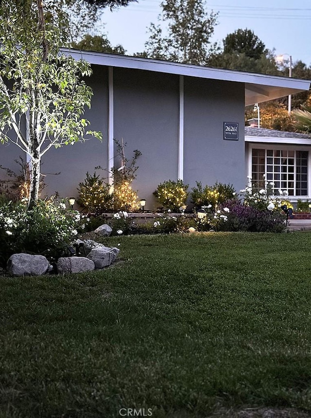 view of home's exterior featuring a lawn