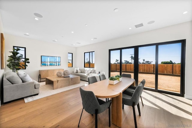 dining space featuring light hardwood / wood-style floors