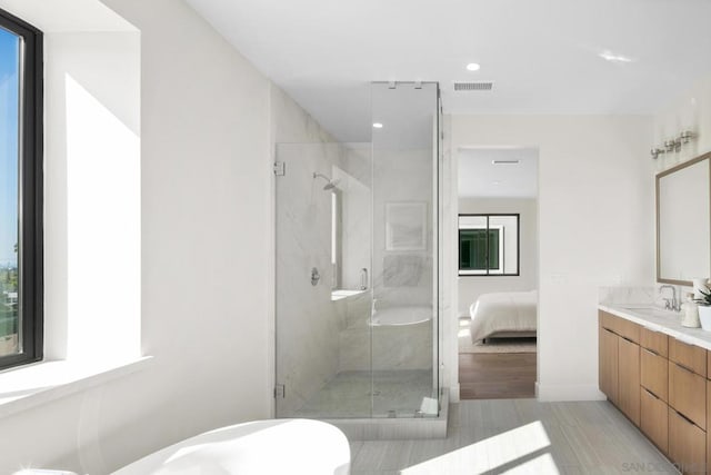 bathroom with vanity and an enclosed shower