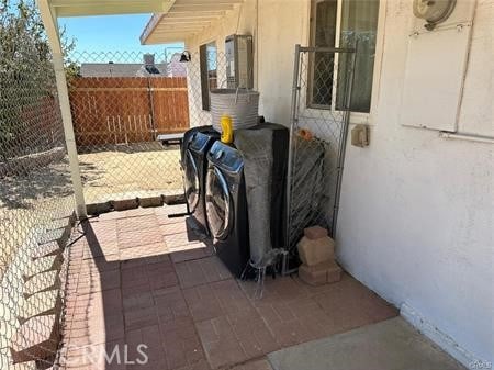 view of patio featuring washer and dryer