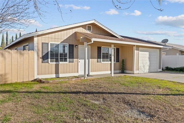 ranch-style house with a garage and a front lawn