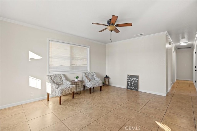 living area featuring crown molding, light tile patterned flooring, and ceiling fan