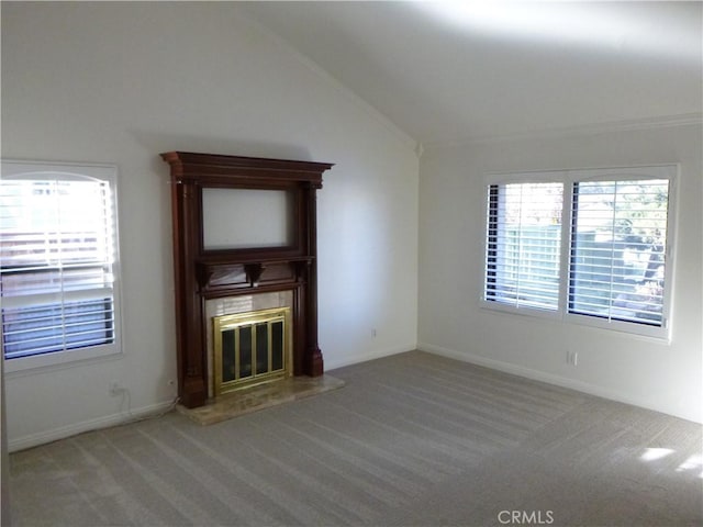 unfurnished living room featuring vaulted ceiling and carpet