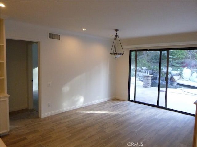 unfurnished room featuring dark hardwood / wood-style flooring