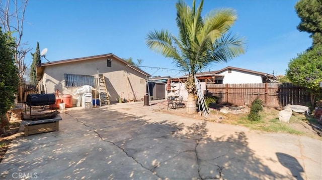 back of house featuring a patio