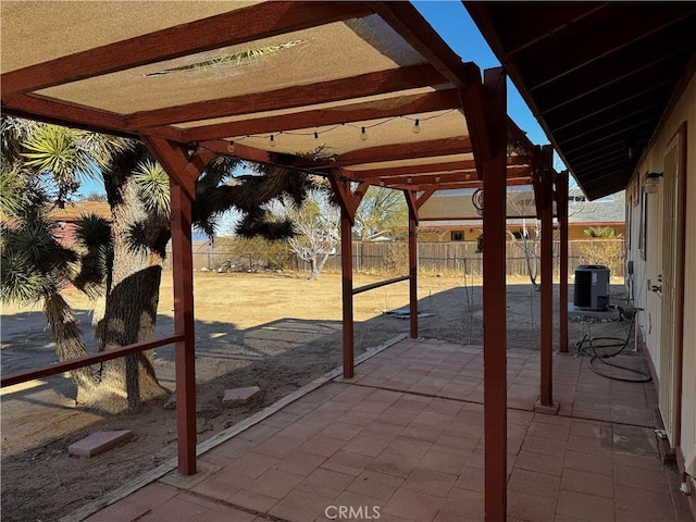 view of patio with central air condition unit and a pergola