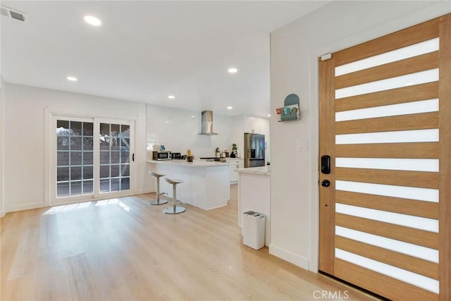 doorway to outside featuring light hardwood / wood-style flooring