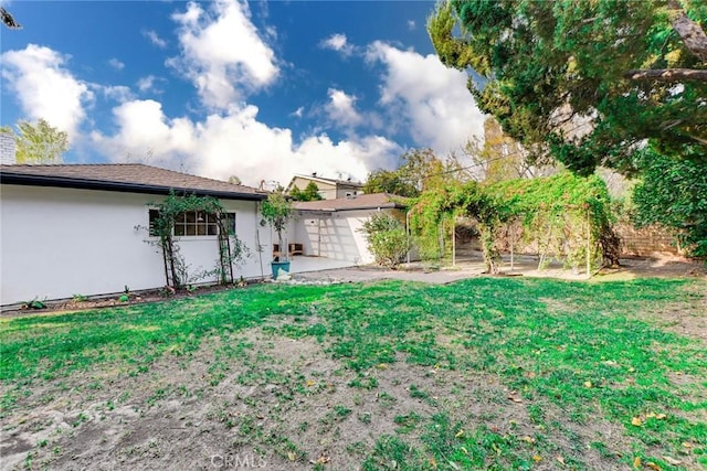 view of yard featuring a garage