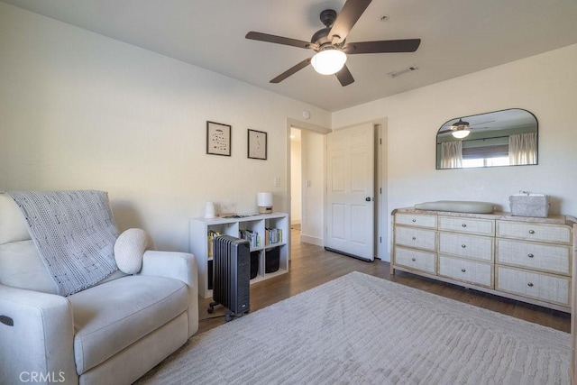 bedroom with ceiling fan and wood-type flooring