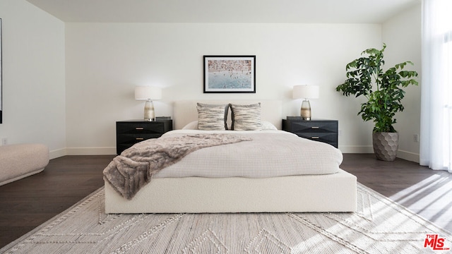 bedroom with hardwood / wood-style floors