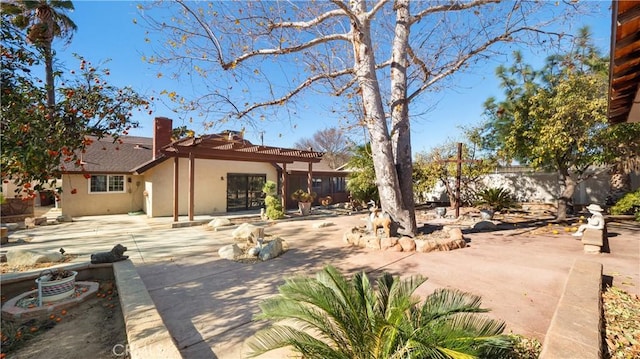 back of house featuring a patio area