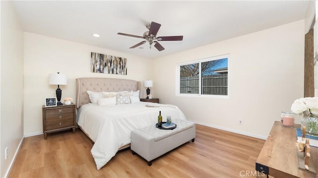 bedroom featuring light hardwood / wood-style flooring and ceiling fan