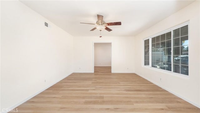 unfurnished room featuring ceiling fan and light hardwood / wood-style flooring