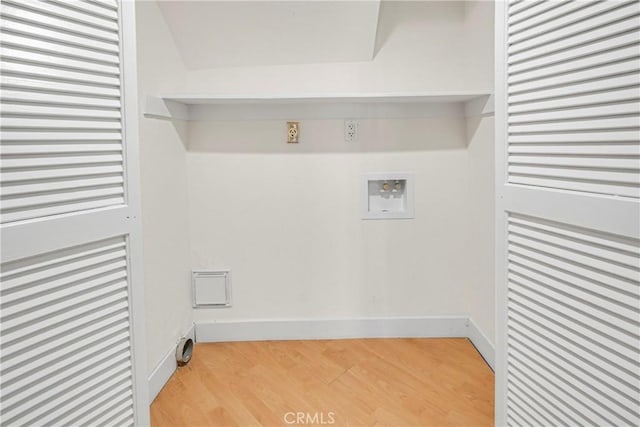 laundry area featuring washer hookup and light hardwood / wood-style flooring