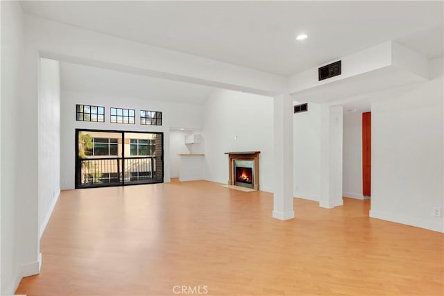 unfurnished living room with light hardwood / wood-style flooring