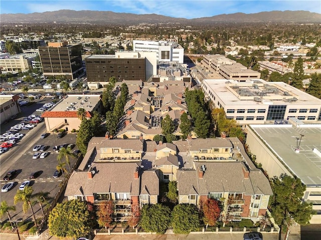 birds eye view of property with a mountain view