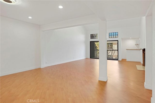 unfurnished living room featuring light hardwood / wood-style floors