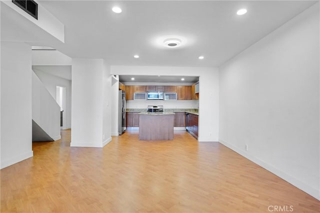 unfurnished living room with light wood-type flooring