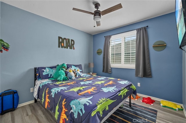 bedroom featuring hardwood / wood-style floors and ceiling fan