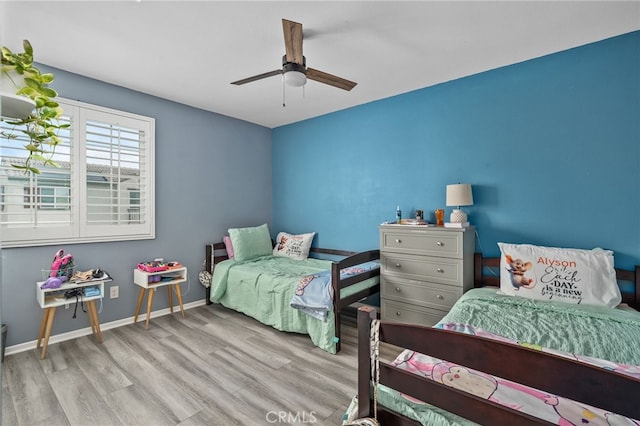 bedroom featuring ceiling fan and light hardwood / wood-style floors