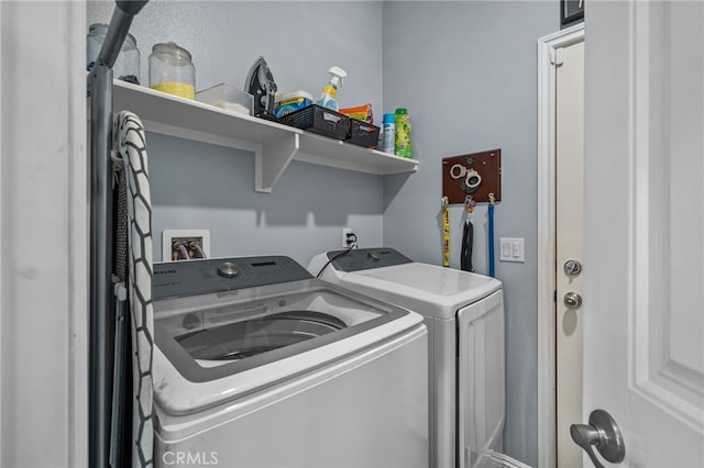 laundry room with independent washer and dryer