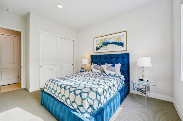 bedroom with carpet floors and a closet