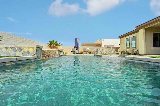 view of swimming pool featuring pool water feature