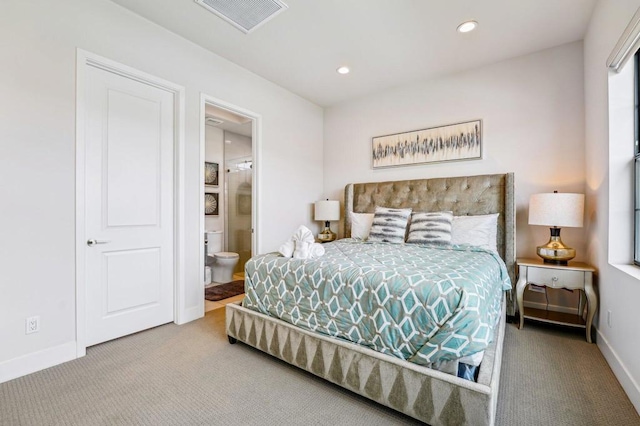 carpeted bedroom featuring connected bathroom