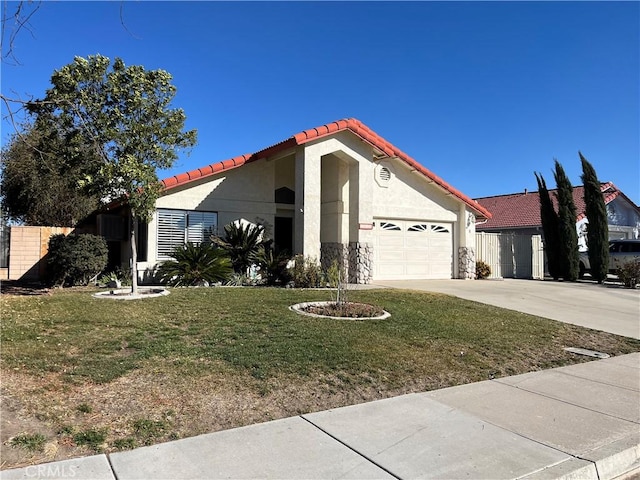 view of front of house with a garage and a front yard