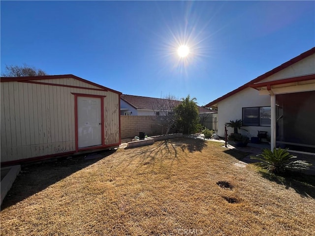 view of yard with a storage unit