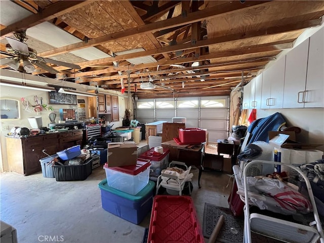 garage featuring a garage door opener and ceiling fan