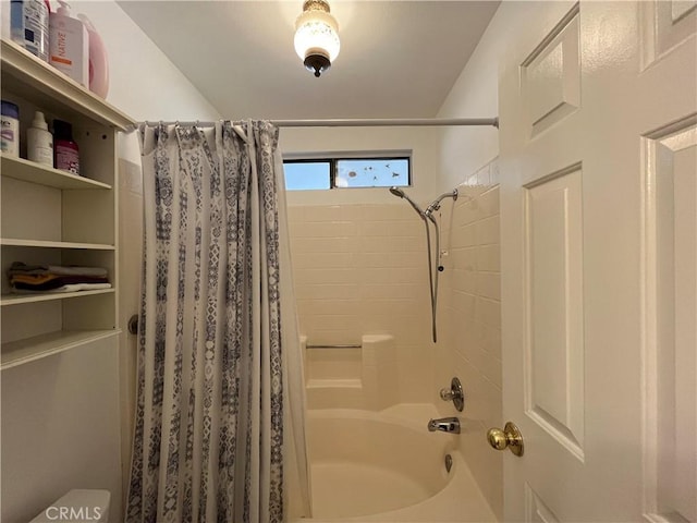 bathroom with toilet and shower / bathtub combination with curtain