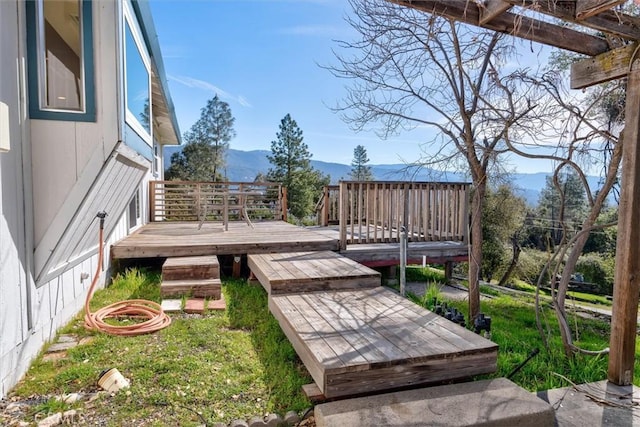 wooden deck with a mountain view