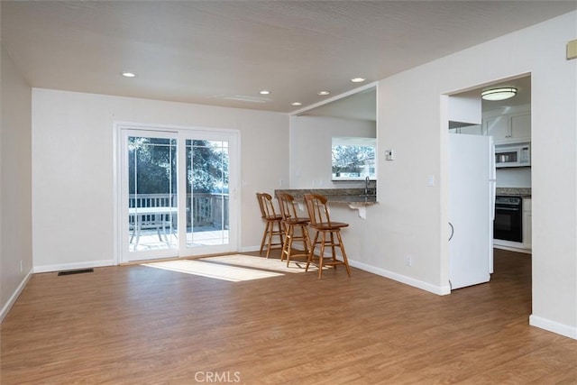 interior space with hardwood / wood-style flooring