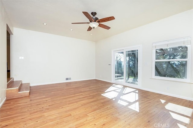 spare room featuring ceiling fan and light hardwood / wood-style flooring