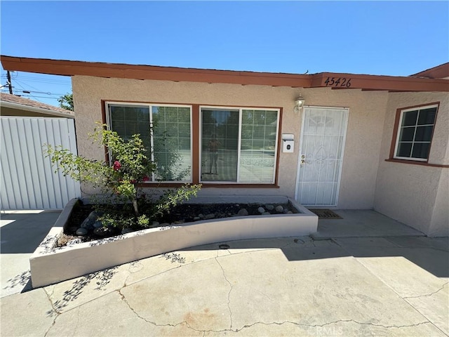 doorway to property with a patio