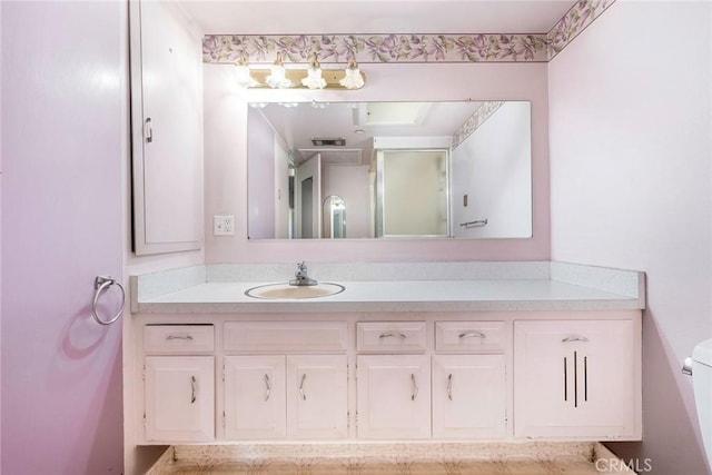 bathroom with toilet and vanity