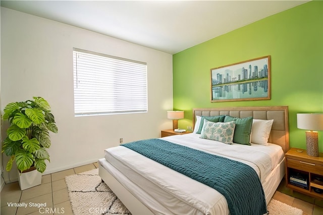 bedroom featuring light tile patterned floors