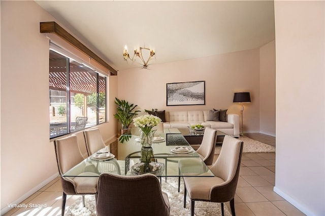 dining area featuring baseboards and light tile patterned flooring