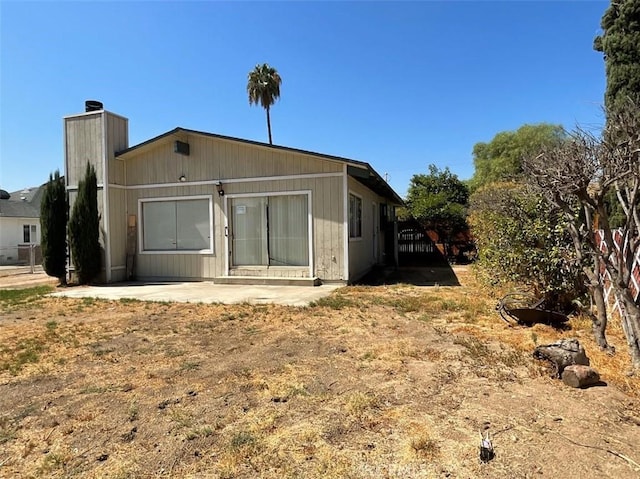 back of property featuring a patio