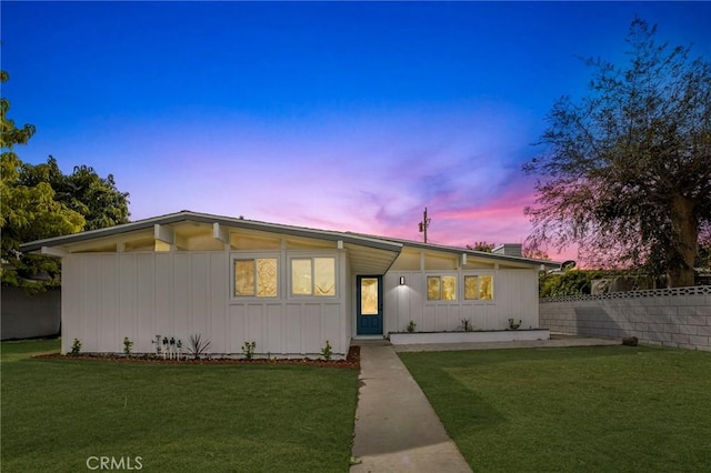 view of front of property with a lawn