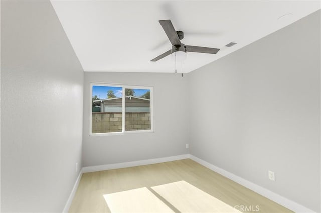 empty room with light hardwood / wood-style floors and ceiling fan