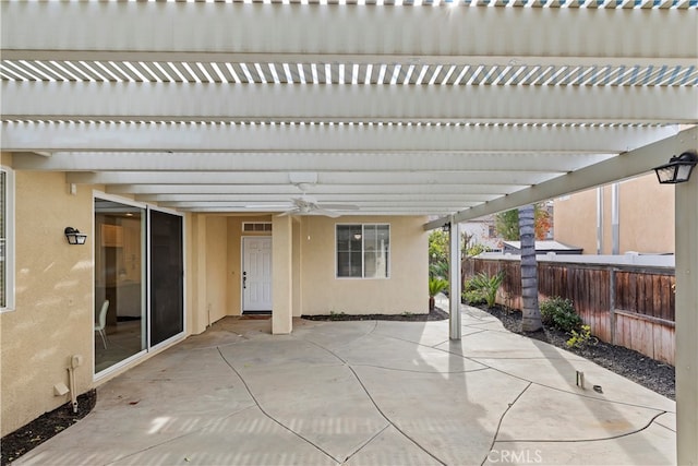 view of patio / terrace featuring ceiling fan and a pergola