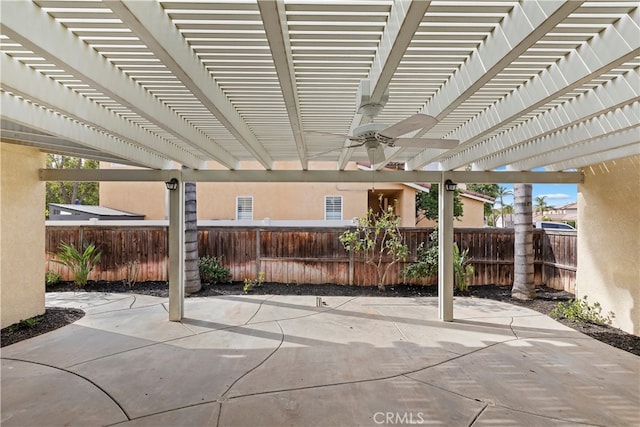 view of patio with ceiling fan and a pergola